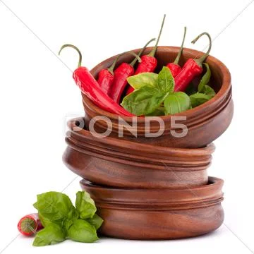 Hot red chili or chilli pepper in wooden bowls stack Stock Photos