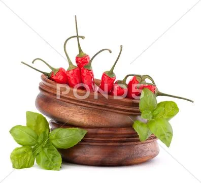 Hot red chili or chilli pepper in wooden bowls stack Stock Photos