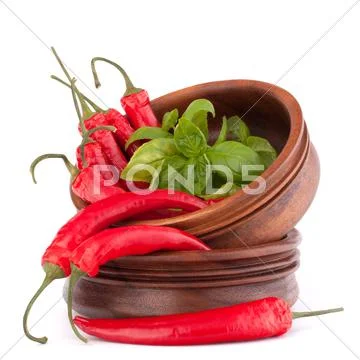 Hot red chili or chilli pepper in wooden bowls stack Stock Photos