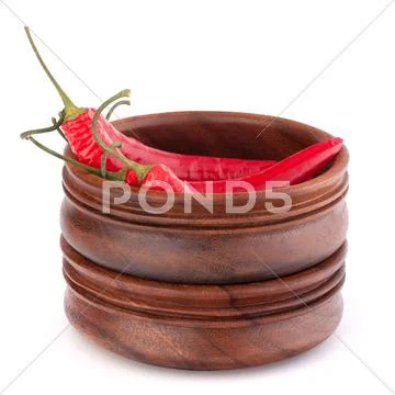 Hot red chili or chilli pepper in wooden bowls stack Stock Photos