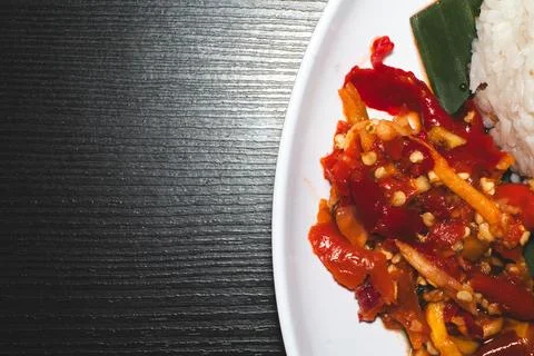 Hot red chilli paper in close up served on white plate. Macro photo of spic.. Stock Photos