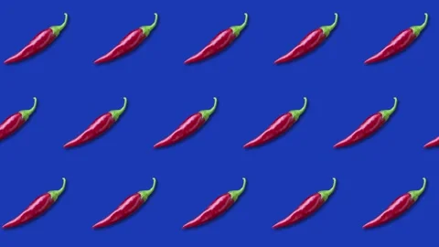 Hot red pepper, background of peppers on a blue background. 4K Stock Footage 345501387