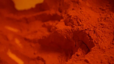 Hot red pepper powder creating textured culinary ingredient background Stock Footage 333497155