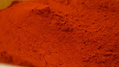 Hot red pepper powder creating a textured background for culinary concepts Stock Footage 333521358