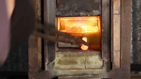 Hot rivets in a gas forge. Stock Footage 137853627
