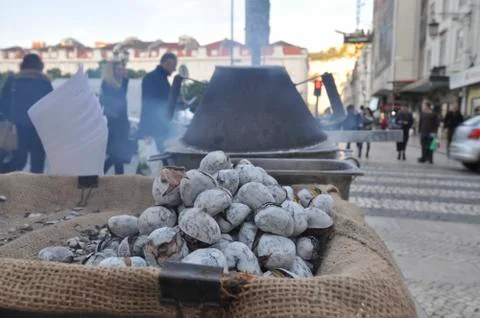 Hot roasted chestnuts. Stock Photos