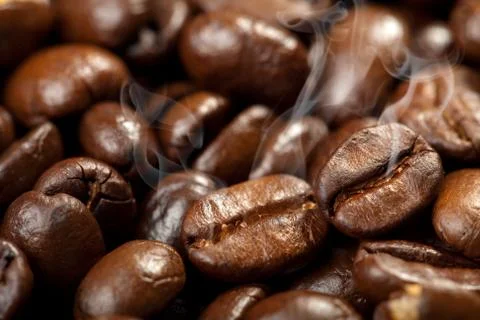 Hot roasted coffee beans background Stock Photos