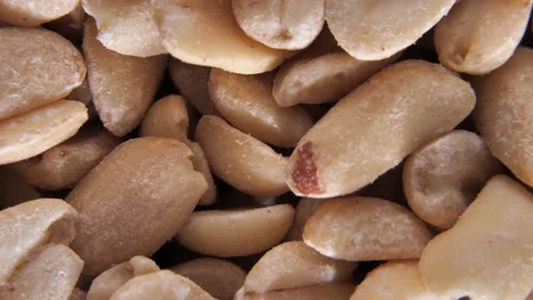 Hot roasted peanuts spins, shelled peanuts, ground nuts. Spicy peanuts rotate Stock Footage 233996764