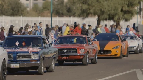 Hot Rods being driven through a parade 스톡 동영상 100004634