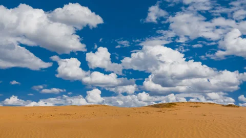 Hot sandy desert under blue cloudy sky time lapse scene Stock Footage 155107014