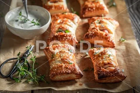 Hot sausage in puff pastry as a snack for breakfast Stock Photos