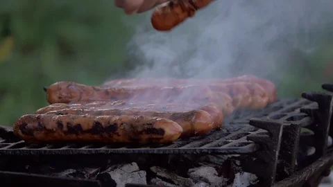 Hot sausasges on the grill Stock Footage 128609796