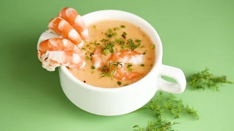 Hot savory shrimp chowder with dill and chives in elegant ceramic cup Stock Footage 324762093
