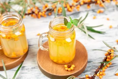 Hot sea buckthorn tea with ginger and honey Stock Photos