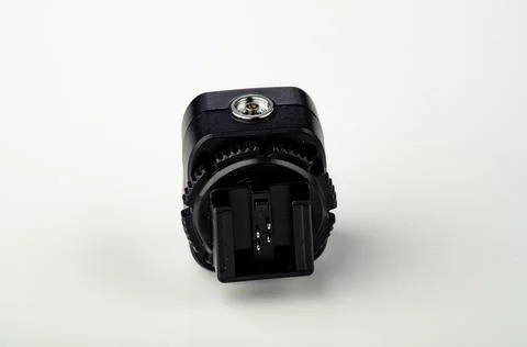 Hot shoe flash trigger sync adapter. Stock Photos