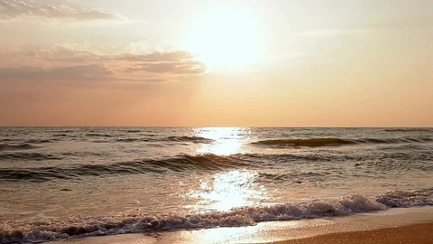 Hot Sky Dramatic Clouds over Waves Washing Shore Sand Video stock 91325384