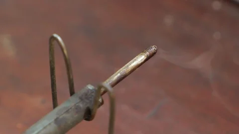 Hot soldering iron on a stand in the workshop, close up, slow motion Video stock 95829657