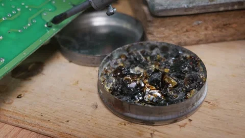 Hot Soldering Iron Tip Dipped Into Rosin Flux for Electronics Repair 動画素材 338331608