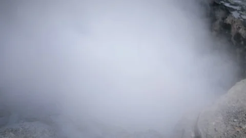 Hot spring boils and smokes from the ground Stock Footage 102254154