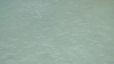 Hot spring bubbles in an active crater Stock Footage 307420532