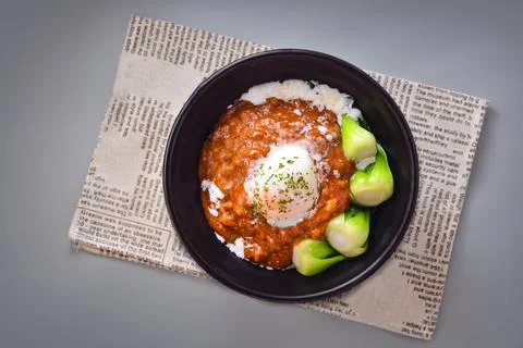 Hot spring egg and beef rice served in bowl isolated on napkin top view of .. Stock Photos