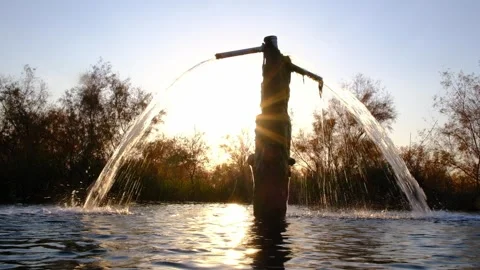 Hot spring mineral water gushing from a well silhouette at Ayak-Kalkan source Stock Footage 345155443