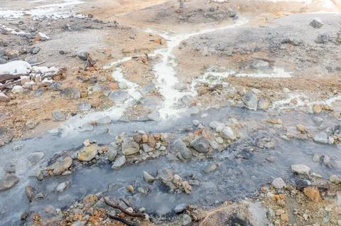 Hot spring stream flowing through rocks in Jigokudani Hell Valley Stock Photos