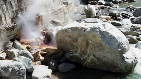 Hot Spring Water Meeting Cold Mountain Stream at Manikaran Sahib Stock Footage 345368603