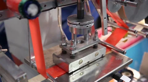 Hot stamping press for printing labels in red tape Stock Footage 61914486