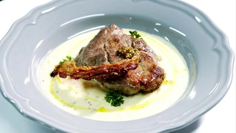 Hot steak on white with bacon Stock Footage 71086893