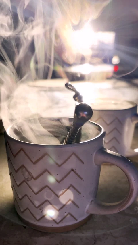 Hot steam rises in morning light from poured black coffee in mugs Stock Footage 344010875