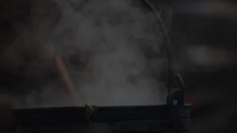 Hot Steam Rising from Rustic Cauldron Over Fire, Medieval Village Kitchen Stock Footage 297092592
