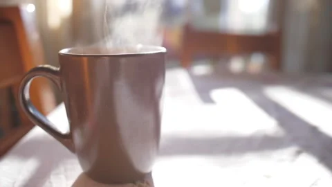 Hot steam tea cup slow motion Stock Footage 146490997