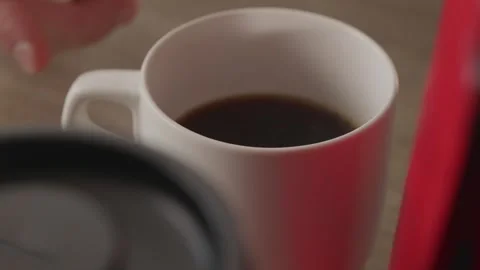 Hot steaming coffee cup with hand moving away lifestyle shot Stock Footage 335143402