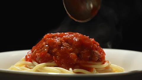 Hot Steaming Spaghetti Bolognese on Black Background Stock-Footage 345773861