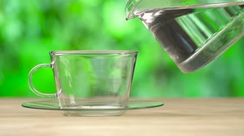 Hot steaming water pouring in to the cup. Stock Footage 55912056