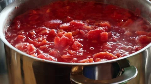 Hot steamy stewed tomatoes Stock Footage 41472787