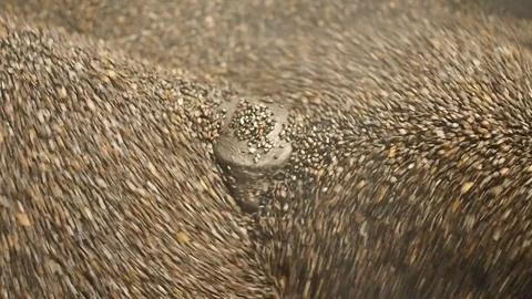Hot stone mixing machine for roasting chestnuts, close up perspective Stock Footage 87388193