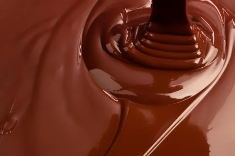 Hot swirl chocolate background, splash liquid cocoa Stock Photos