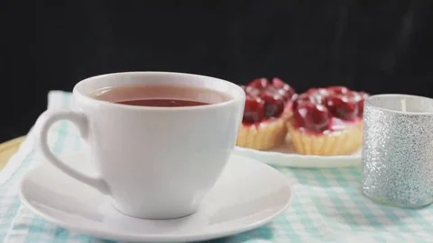 Hot tea and cherry dessert. Delicious breakfast Stock Footage 69196695