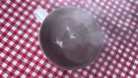 Hot tea in the cup on the table Stock Footage 220740672