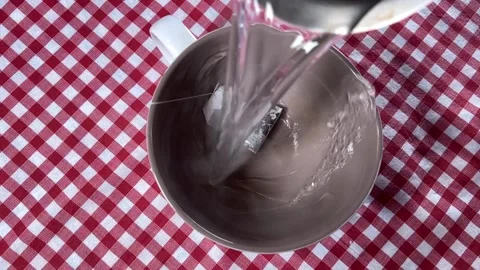 Hot tea fills a cup on the table Stock-Footage 220740708