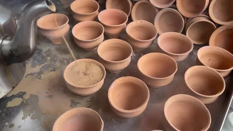 Hot tea getting served in a kulhad in a ... | Stock Video | Pond5
