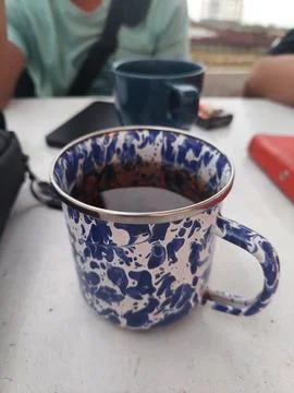 Hot tea that has been brewed in a traditional blue patterned cup Stock Photos