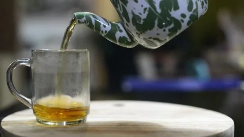 Hot tea has just been poured into a glass Stock Footage 244709164