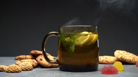 Hot tea with lemon and mint Stock Footage 109797399