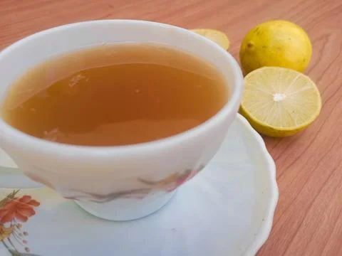 Hot tea with lemon slice top view isolated on wood background Stock Photos