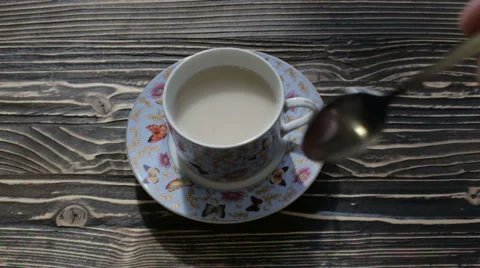 Hot tea with milk on the table Stock Footage 63275327