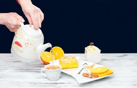 Hot tea with a mug spoon oops orange slices and sugar. Cozy home tea concept Stock Photos