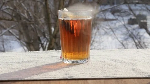 Hot tea outdoors Video stock 73006898